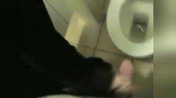 video of Goth girl gives hj in public toilet