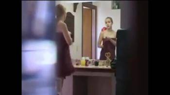 video of blonde getting ready mirror