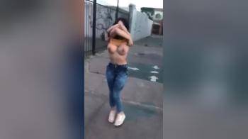 video of Flashing her big tits and pussy in the middle of the street