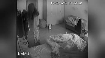 video of night vision security camera in bedroom records woman undressing