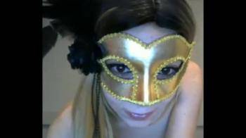 video of Masked babe plays with toy on webcam