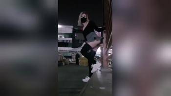 video of asian girl with dildo mounted on fence in public garage