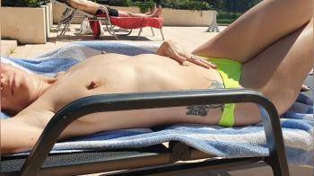 video of Enjoying the sun and touching herself at the hotel pool