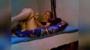 video of girl on her webcam playing on her bed