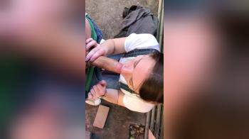 video of Brunette sucks her boyfriend in a back alley