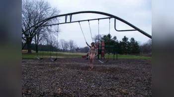 video of Nude on a swing in the park
