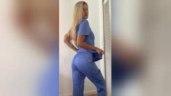 video of Smokin hot blonde strips out of her scrubs