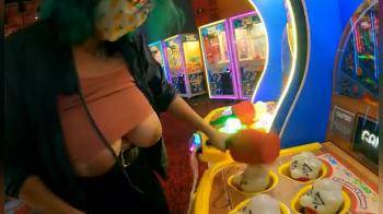 video of playing wak-a-mole with her titties on display