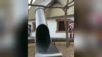 video of Her Lggings come down on the slide