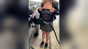 video of pumping gas and showing titties