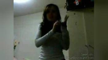 video of Teen Brunette Strips and Teases