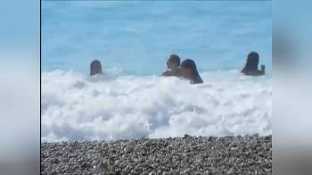 video of Hot chick feels embarrassed when her pussy and tits get exposed by a wave in the sea