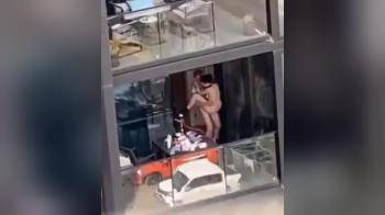 video of couple fucking in front of their neighbors in the building across