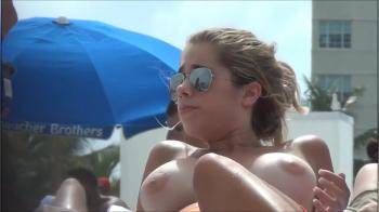 video of Sunglasses hottie with amazing tits on the beach