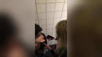 video of Two girls at a party on the toilet fooling around