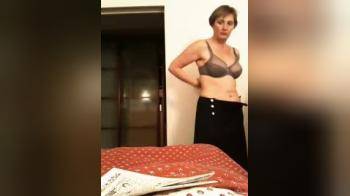 video of Short haired MILF undressing
