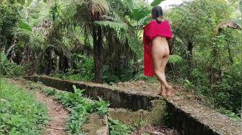 video of Native American girl walking in the rain forest