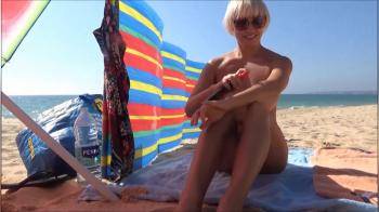video of Naked oiled herself on the beach