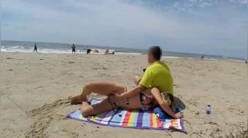 video of naughty girl jerking off a dick on a public beach in front of some fishermen