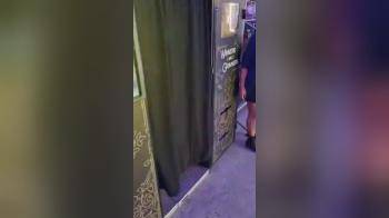 video of 2 wild girls licking pussy in a photo booth in the arcade