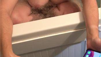 video of Big Wet Bath Tits on her phone