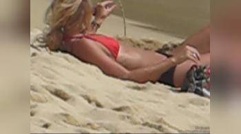 video of chick at the beach