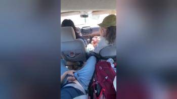 video of daughter sitting next to her mom in the car and strokes her boyfriends cock