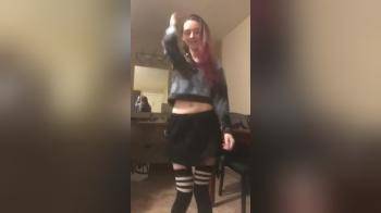 video of Pink haired skinny girl strips to music
