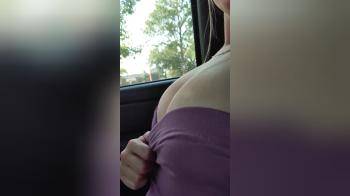 video of Bored Babe Plays With Her Tits In Car