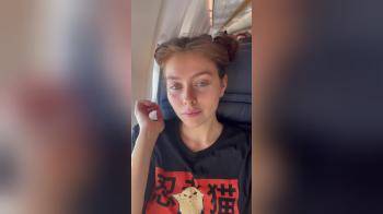 video of Girl is flashing her lovely tits on the plane