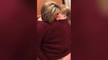 video of Blonde Wives Sharing A Burgundy Sweater Kiss