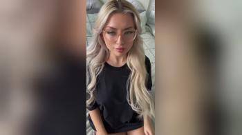 video of blonde in glasses removes clothes