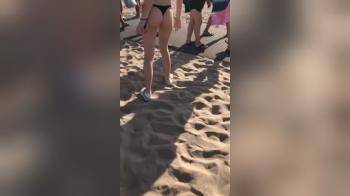 video of cutie in a thong on the beach