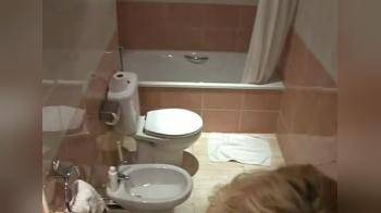 video of Blonde caught on bathroom hotel camera