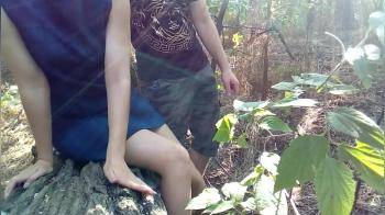 video of Girl in short blue dress getting fucked in forest by her boyfriend