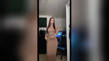 video of Teasing in brown dress
