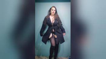 video of Curvy goddess strips off coat to reveal lingerie