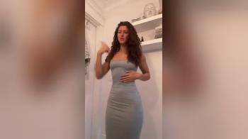 video of Form fitting gray dress