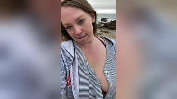 video of Flashing her large tits at the beach