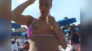 video of beach girl dancing and flashing