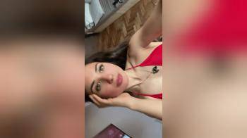 video of Cute brunette posing in sexy red bikini