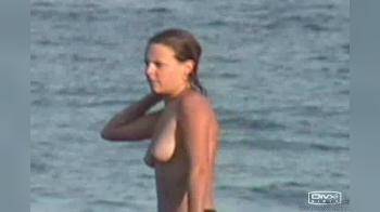 video of Topless takes shower on beach