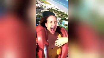 video of Woman s whole tit slips out on slingshot ride.