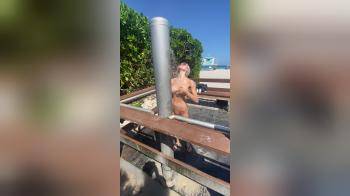 video of Blonde using the outdoor shower