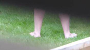video of Candid bare legs and feet at the washing line
