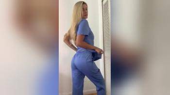 video of Nurse in then out of her scrubs