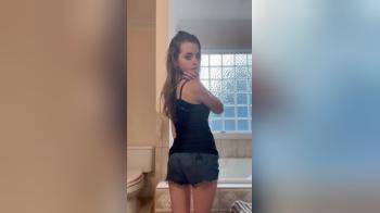 video of Cute college girl strips in the bathroom