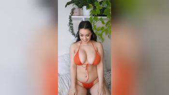 video of Girl in orange bathing suit