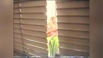 video of Hot Blonde Changing Window