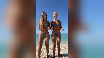 video of dancing mother and daughter on the beach